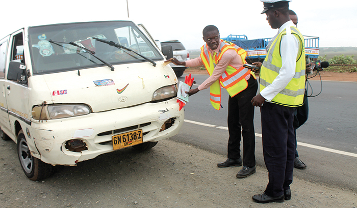 A commercial car without fog lights and damaged head lights being accessed by some officials from DVLA during the exercise.
